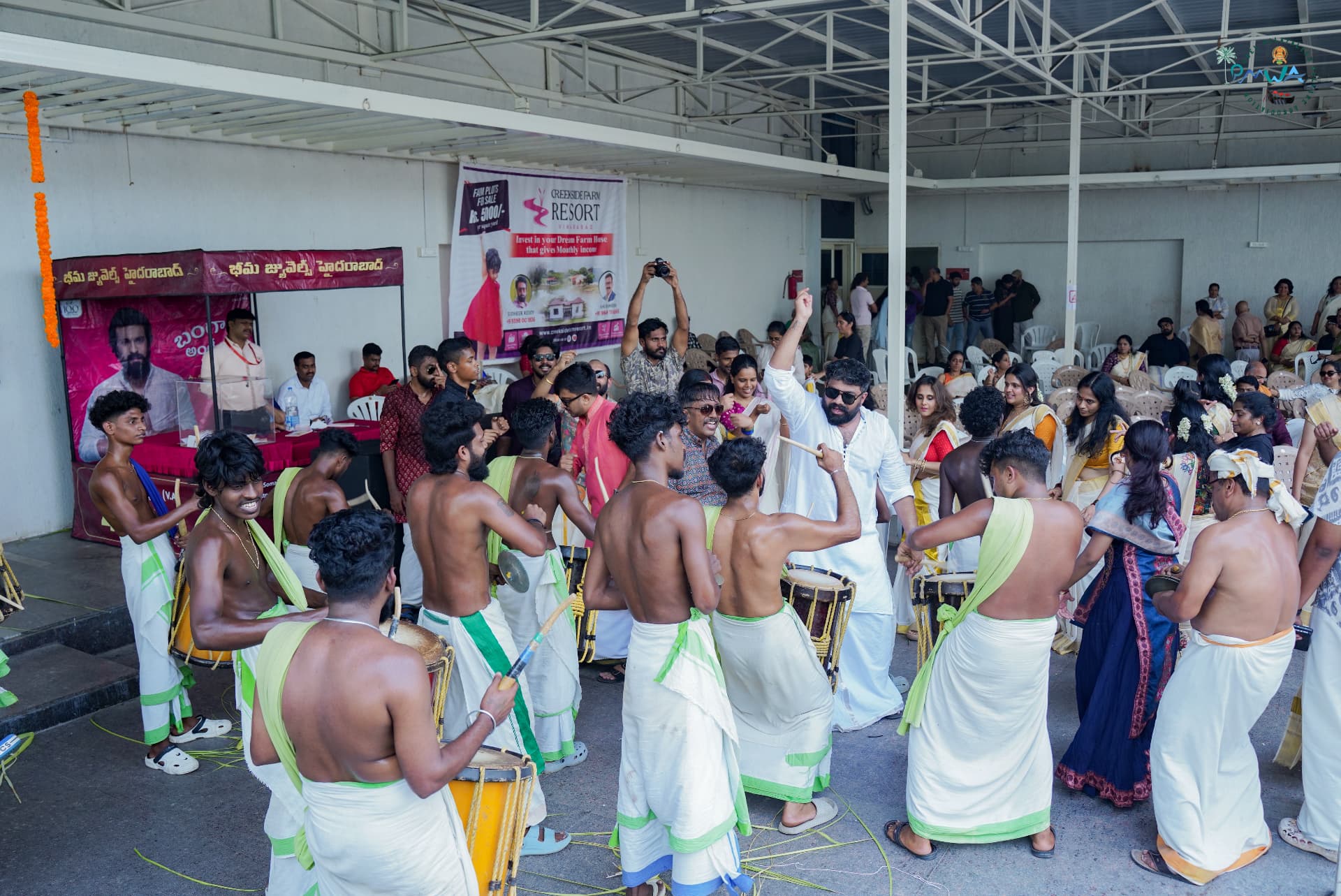 Residents gathered around a chenda melam performance